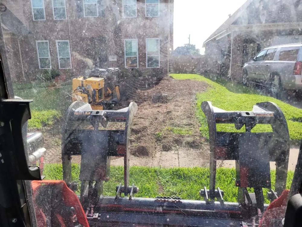 Stump grinding equipment set up on a residential lot